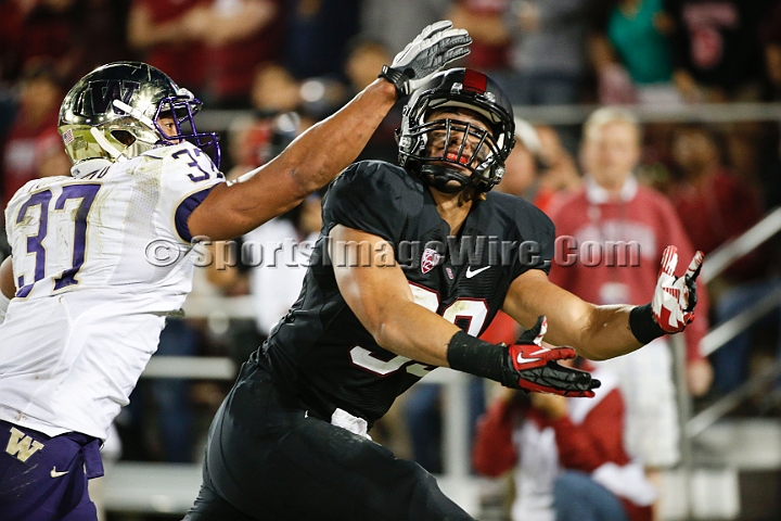2013Stanford-Wash-062.JPG - Oct. 5, 2013; Stanford, CA, USA; Stanford Cardinal tight end Luke Kaumatule (99) misses a pass while being defended by Washington Husky linebacker Princeton Fuimaono (37) at  Stanford Stadium. Stanford defeated Washington 31-28.